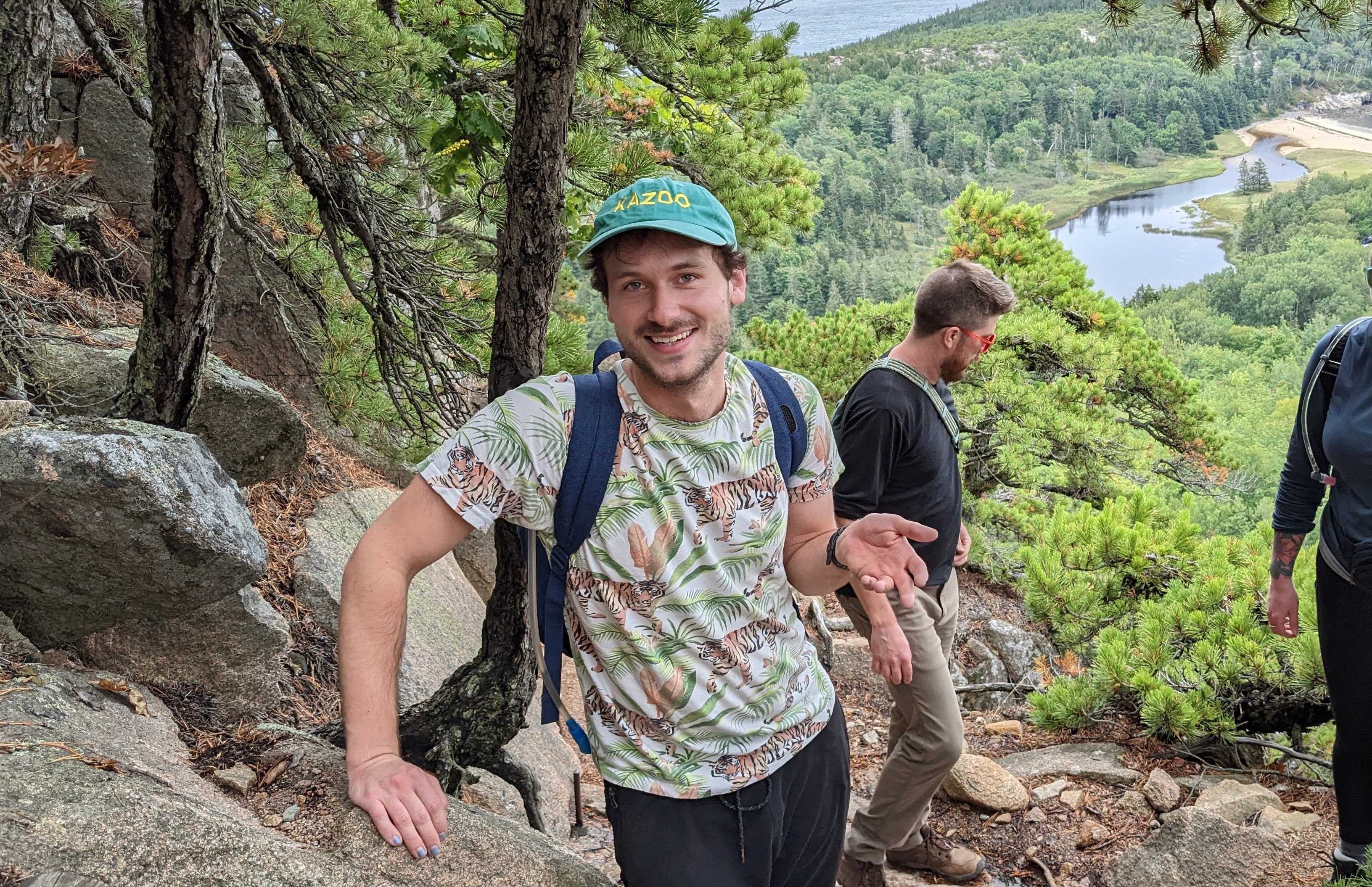 picture of me with a million dollar smile on the side of the Beehive hike in Acadia National Park